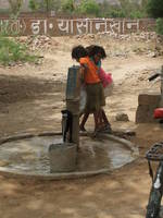 Children at a water pump near Ranthambhore