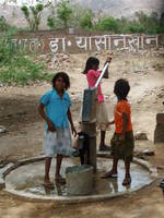 Children at a water pump near Ranthambhore